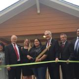 Claudia Mejia, Rep. Lloyd Doggett, and others at the unveiling of a "green" home