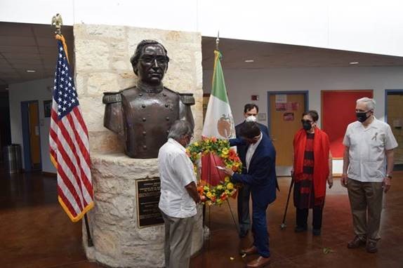The group lays the wreath